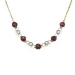 A garnet and colourless paste necklace.