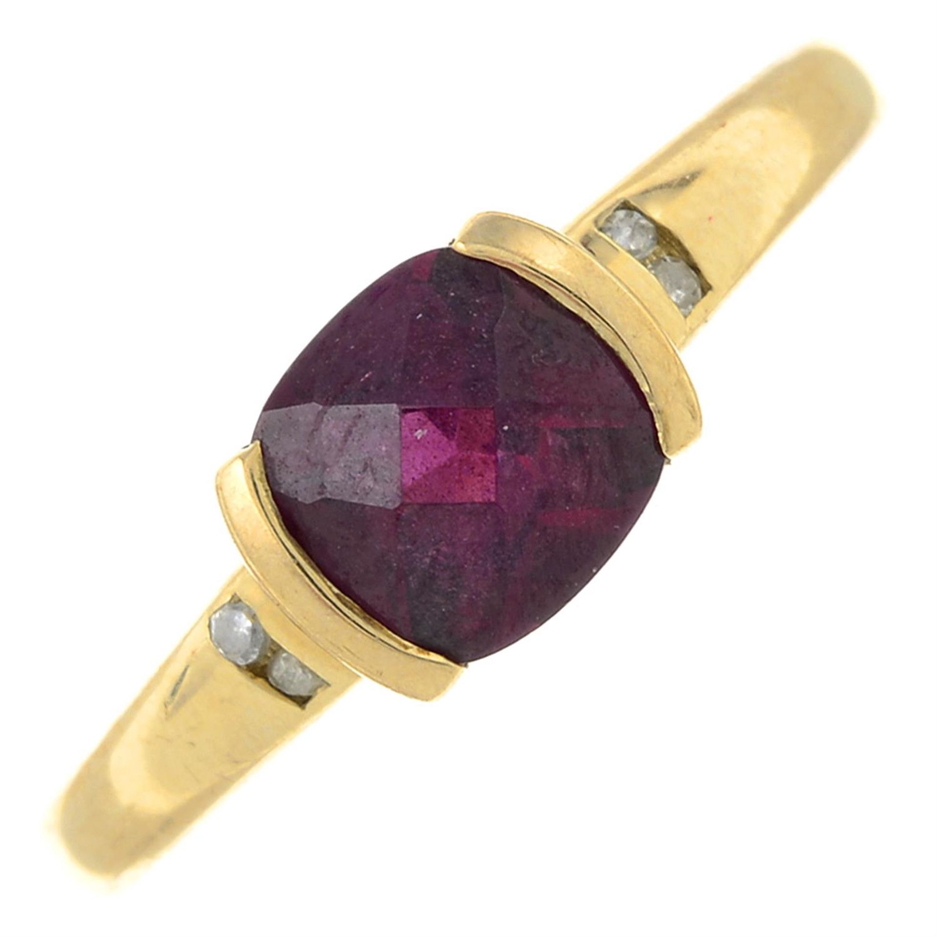 A 9ct gold garnet and diamond band ring.