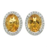 A pair of 18ct gold citrine and diamond cluster earrings.