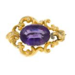 A late 19th century 9ct gold amethyst scrolling brooch.