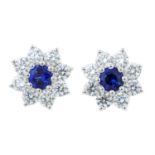 A pair of 18ct gold sapphire and diamond cluster earrings.