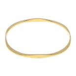 A 9ct gold bangle.