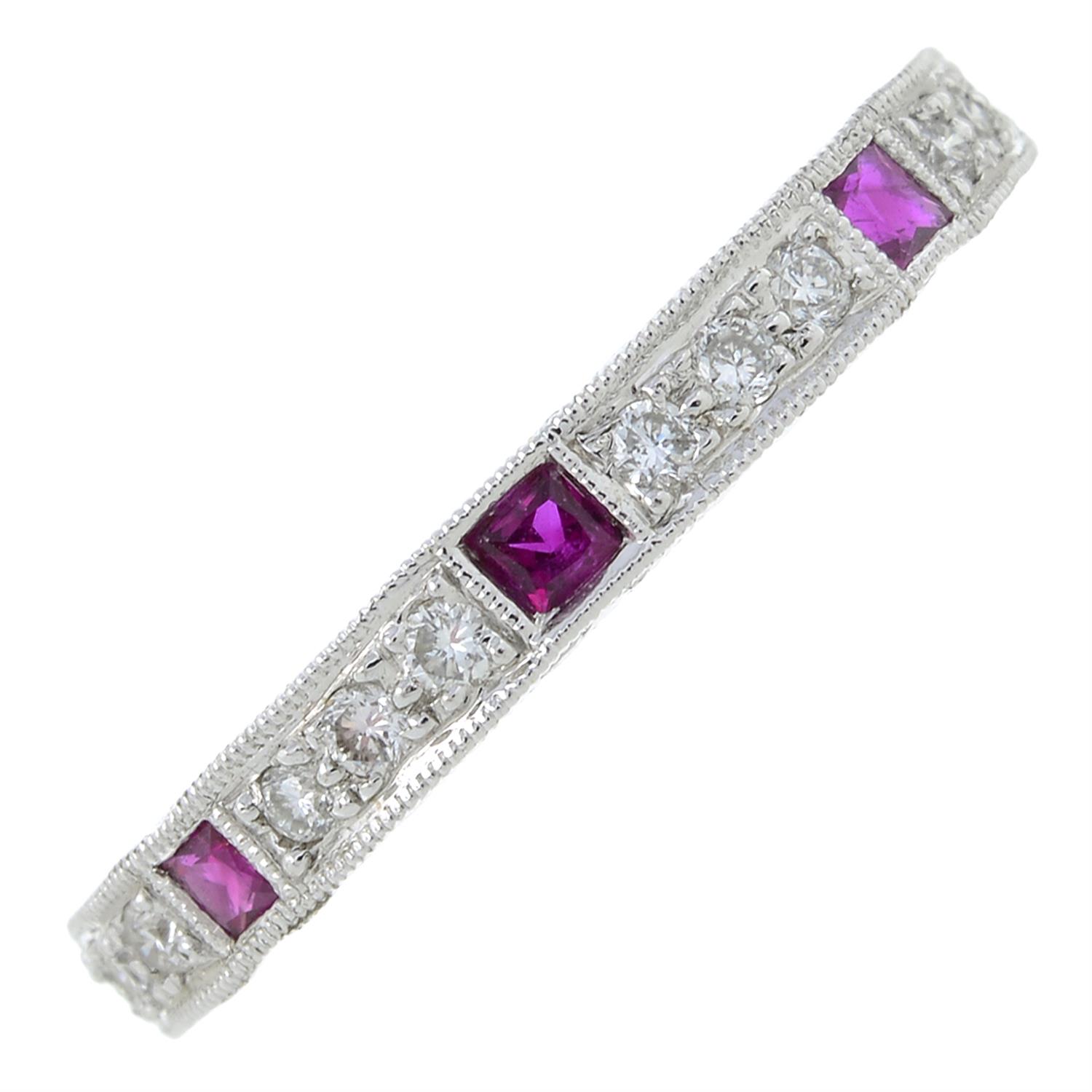 A ruby and brilliant-cut diamond half eternity ring.