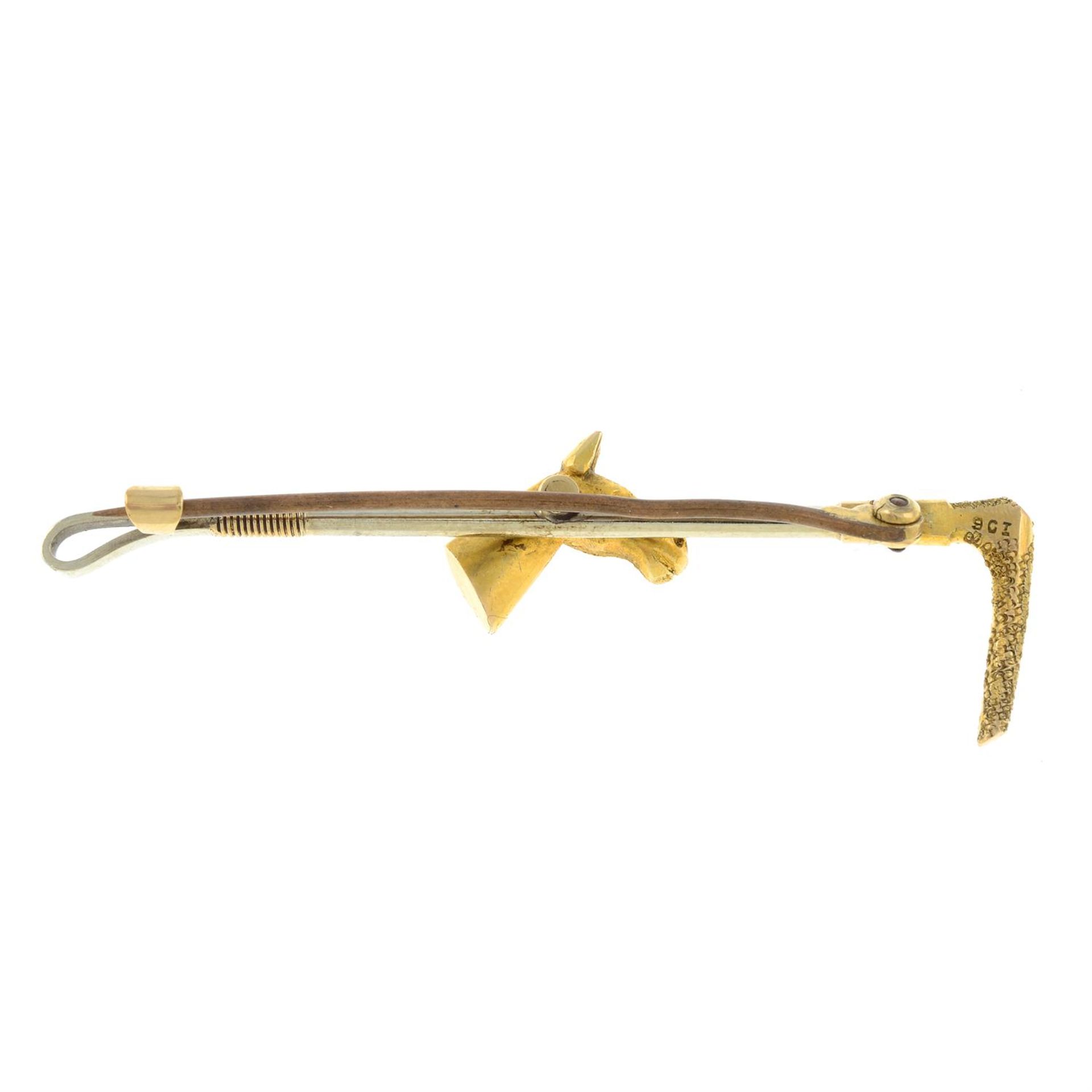 A mid 20th century bi-colour 9ct gold riding crop and horse head bar brooch. - Image 2 of 2