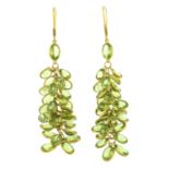 A pair of peridot drop earrings.