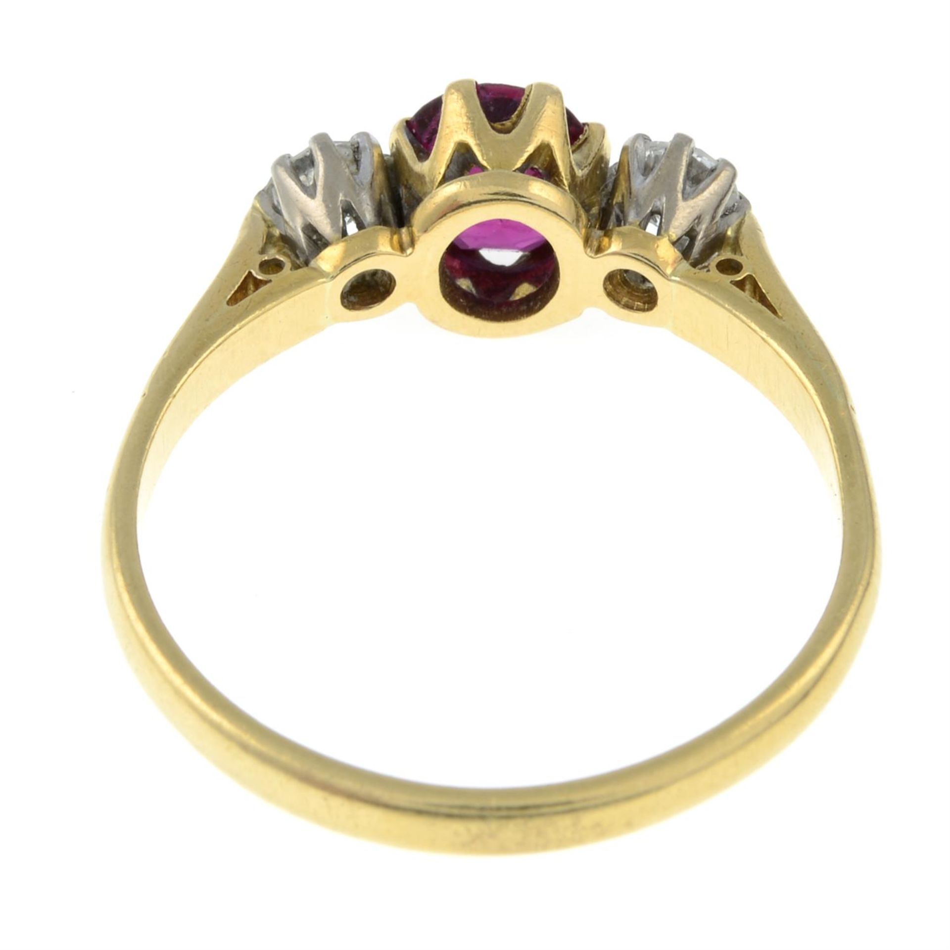 An 18ct gold ruby and diamond three-stone ring. - Image 3 of 3