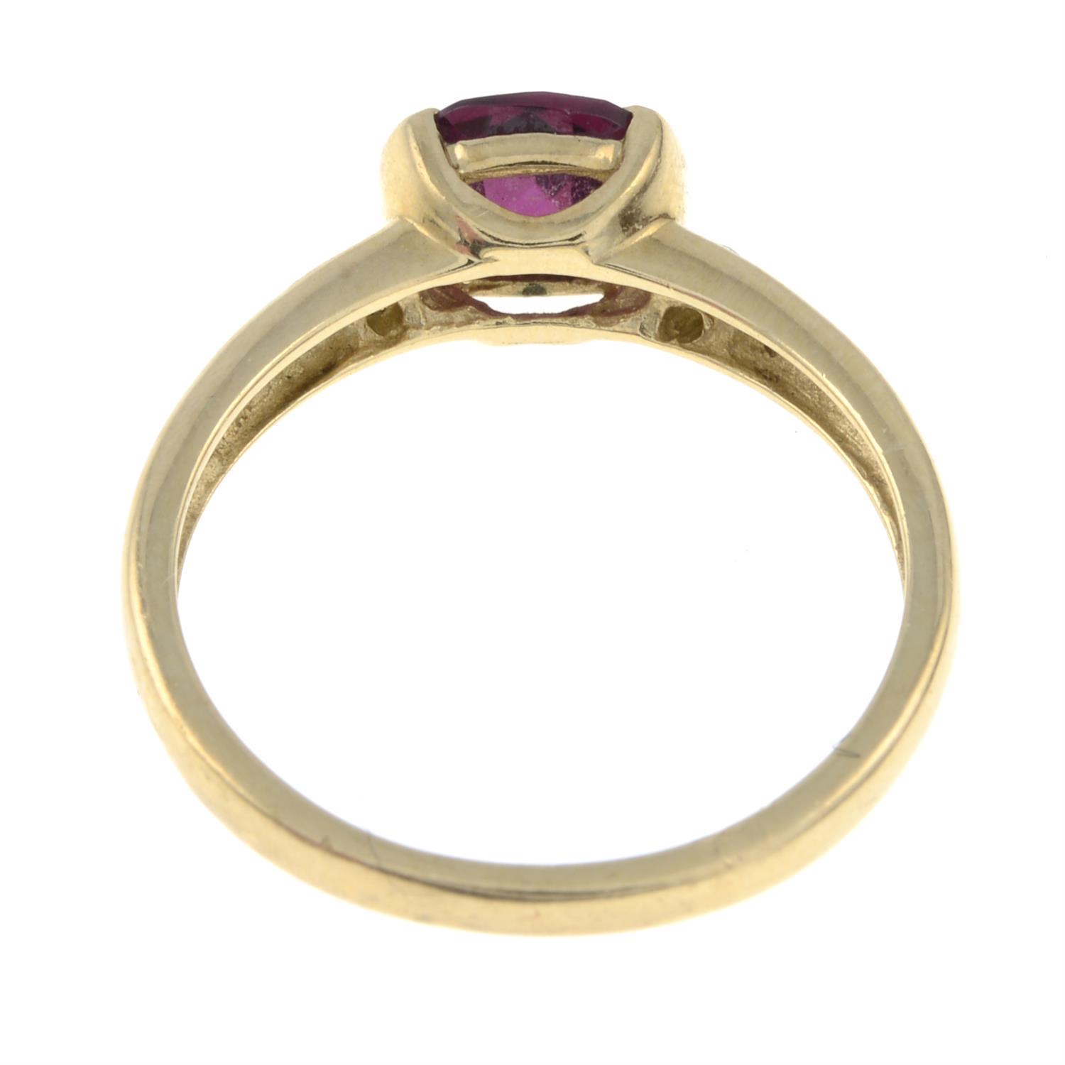 A 9ct gold garnet and diamond band ring. - Image 3 of 3