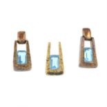 A 9ct gold blue topaz pendant, with matching earrings.