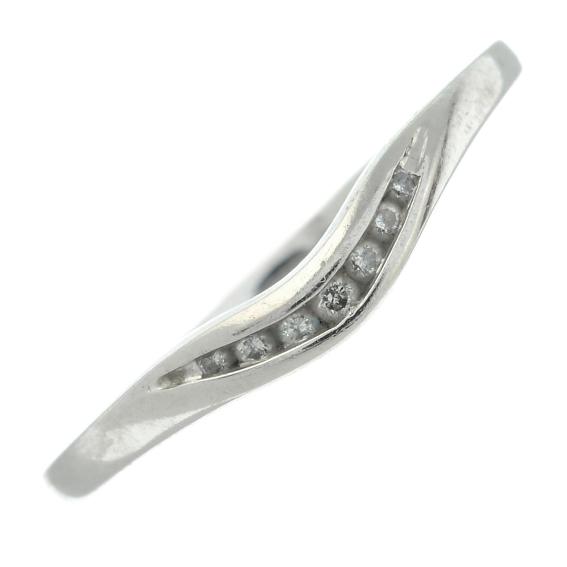 A platinum diamond band ring.