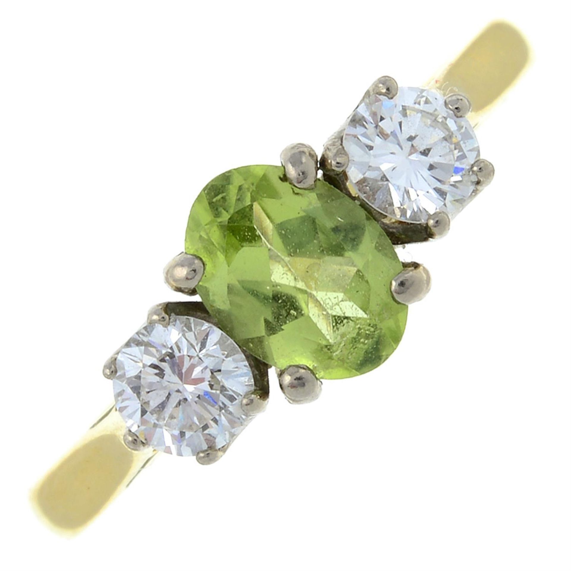 An 18ct gold peridot and diamond three-stone ring.