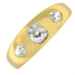 An old-cut diamond three-stone band ring.