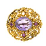 A mid 19th century gold amethyst and ruby filigree brooch.