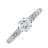 A brilliant-cut diamond single-stone ring, with single-cut diamond shoulders.