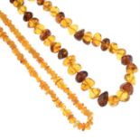 Four cultured pearl, amber and modified amber single-strand necklaces.