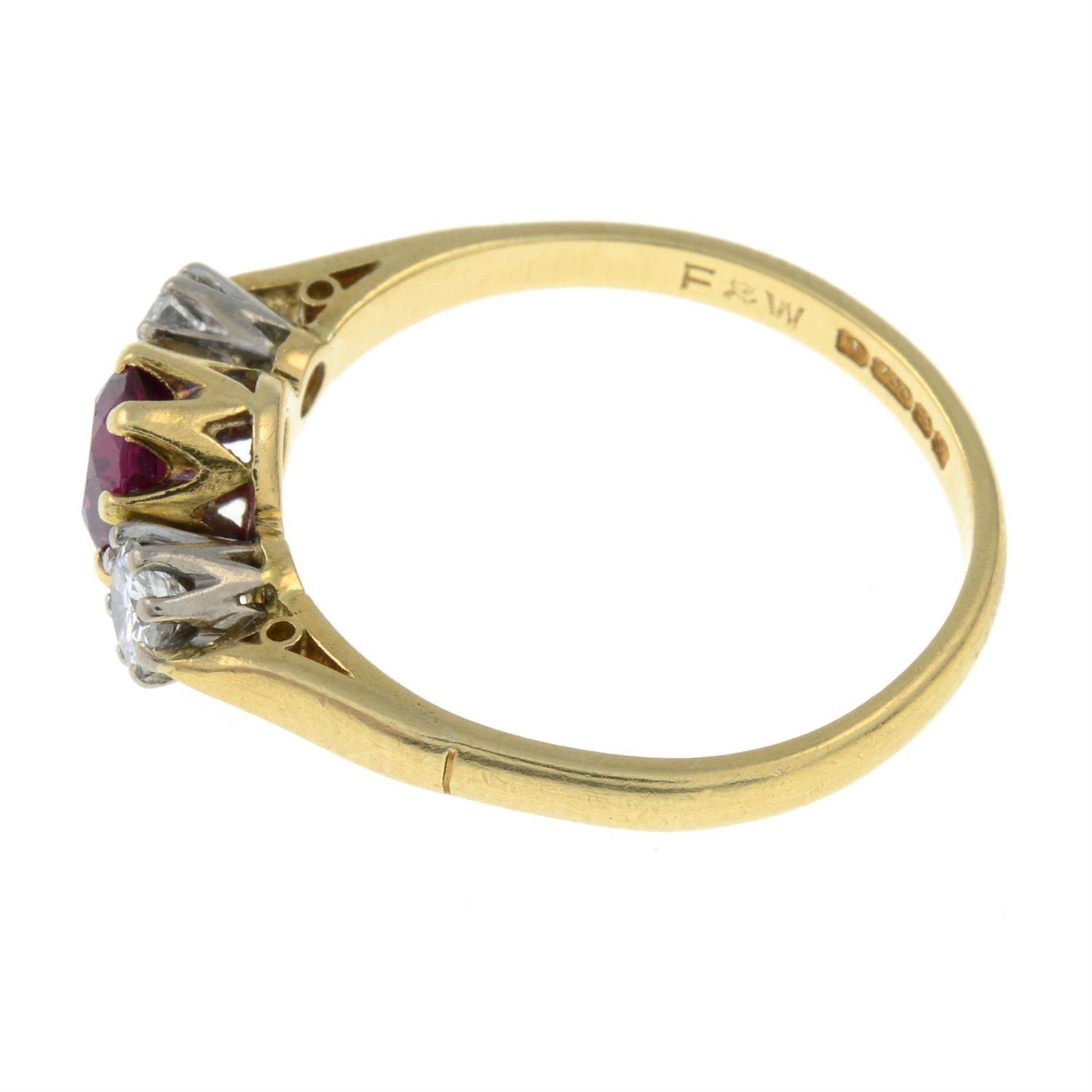 An 18ct gold ruby and diamond three-stone ring. - Image 2 of 3