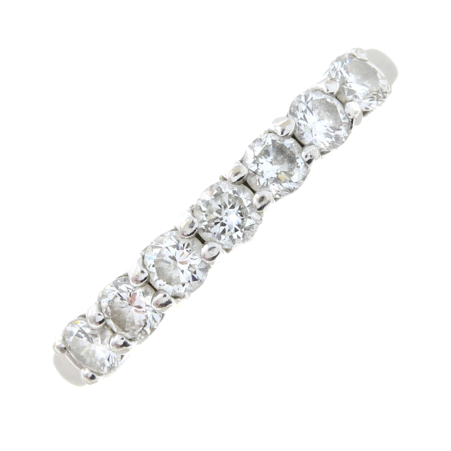 An 18ct gold brilliant-cut diamond half eternity ring.