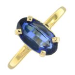 A synthetic sapphire single-stone ring.