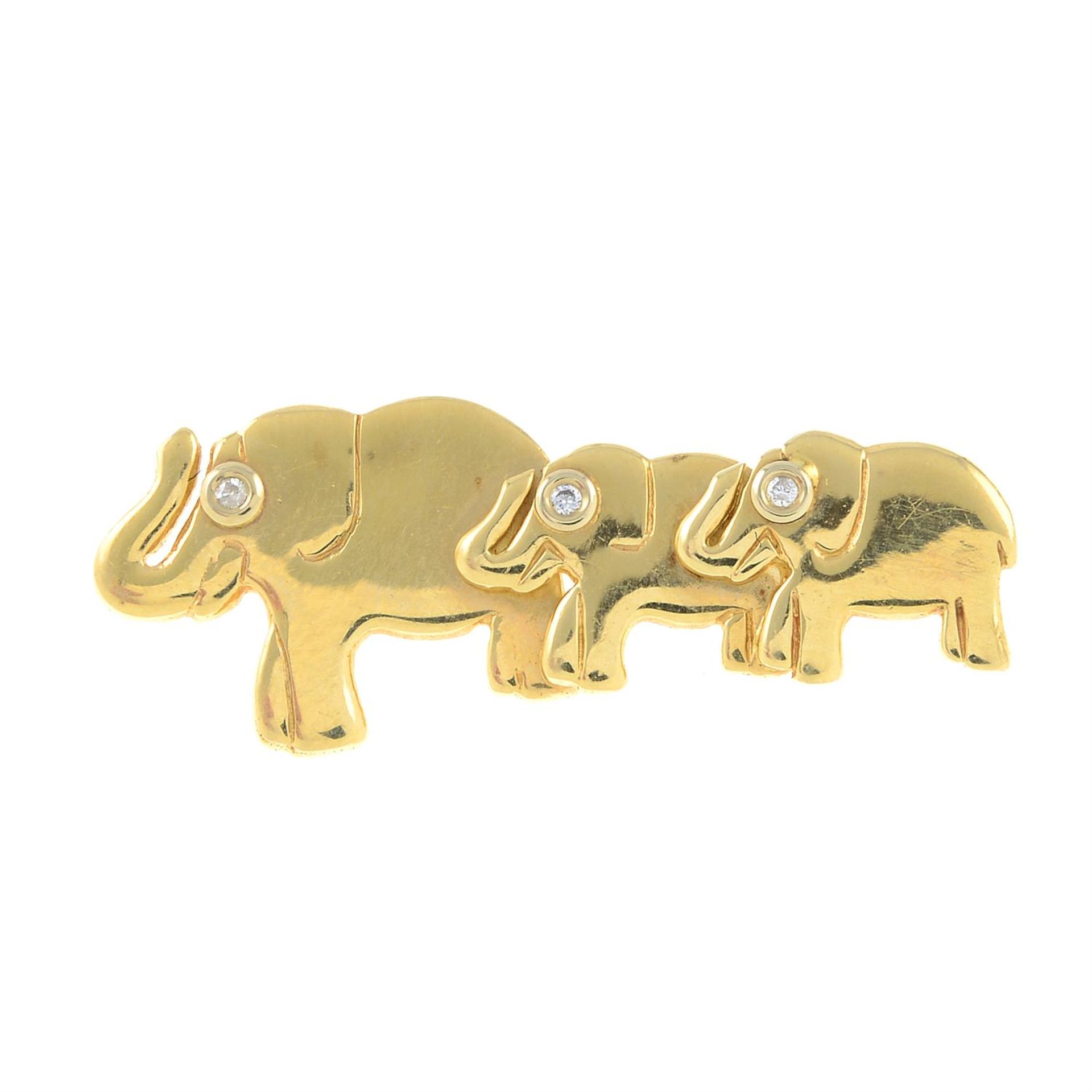 A diamond elephant brooch.