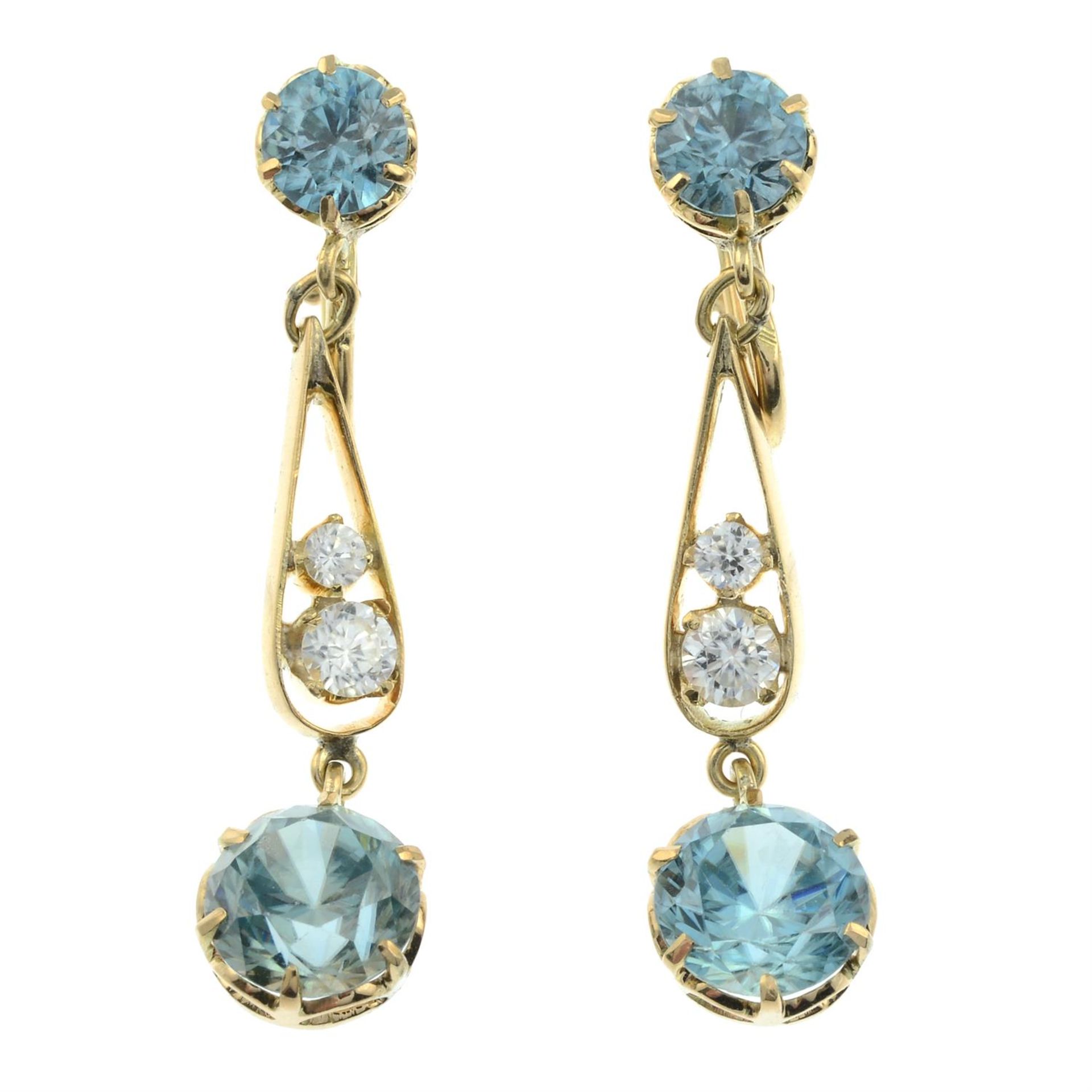 A pair of blue and colourless zircon drop earrings.