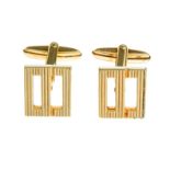 A pair of textured monogram cufflinks, by Christian Dior.