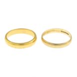 A mid 20th century 22ct gold band ring and a 9ct gold band ring.