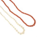 A cultured pearl single-strand necklace, with 9ct gold clasp, and a single-strand coral necklace,