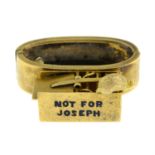 An early 20th century gold enamel scarf clip, depicting a mouse and mouse trap, with the text 'Not