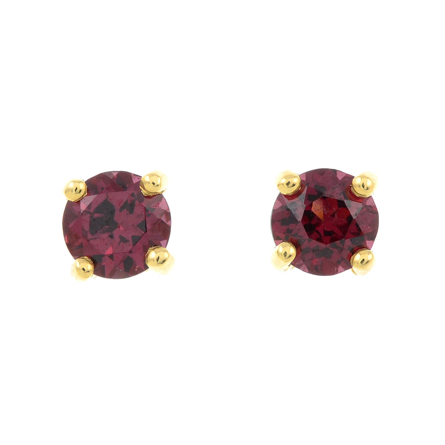 A pair of rhodolite garnet stud earrings.