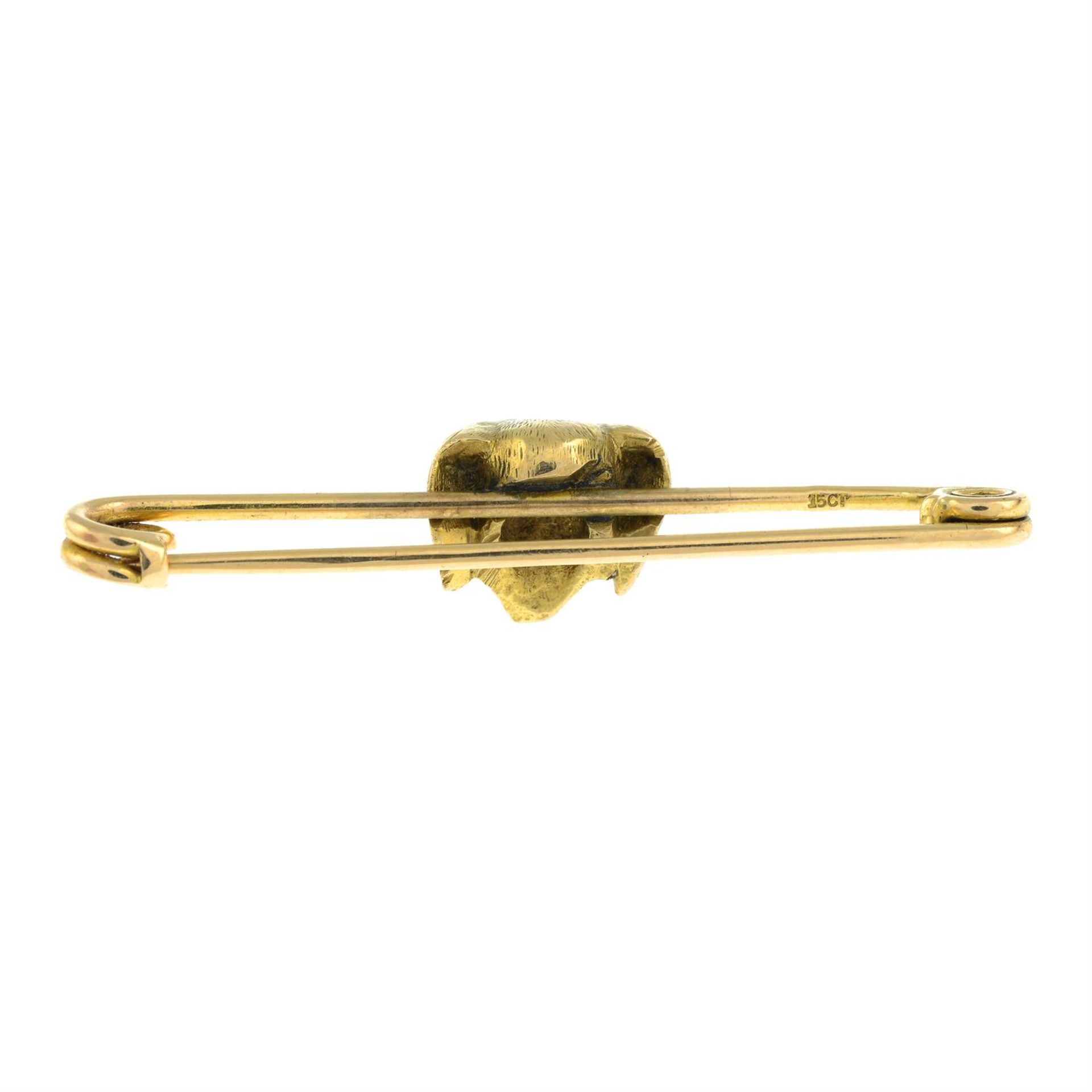 An early 20th century 15ct gold bar brooch of a dog with garnet eyes. - Image 2 of 2