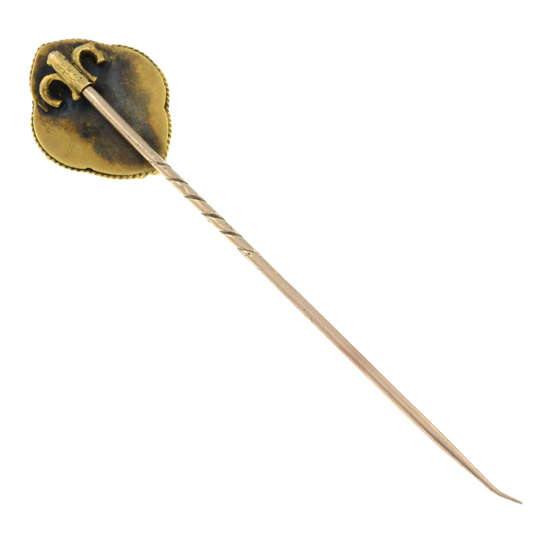 A late Victorian gold enamel and split pearl star stickpin. - Image 2 of 2