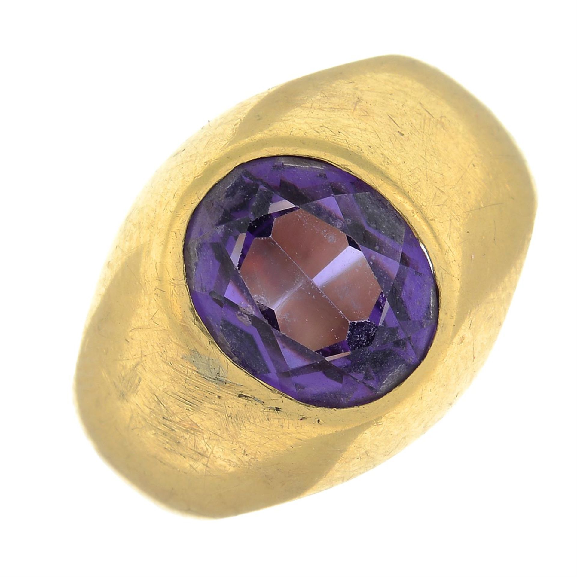 A synthetic colour-change sapphire single-stone ring.