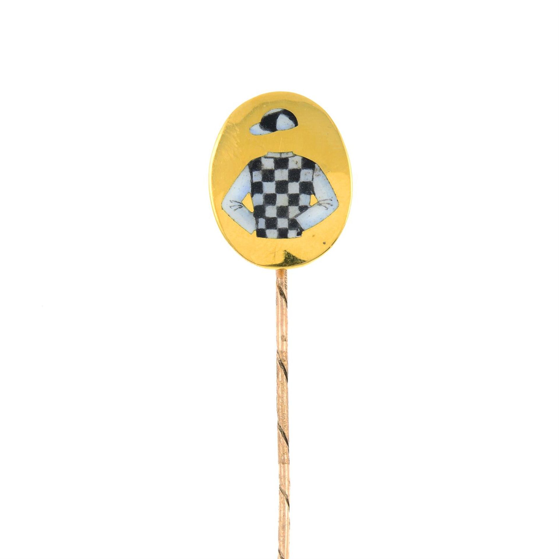 A 9ct gold enamel stickpin, depicting jockey silks.