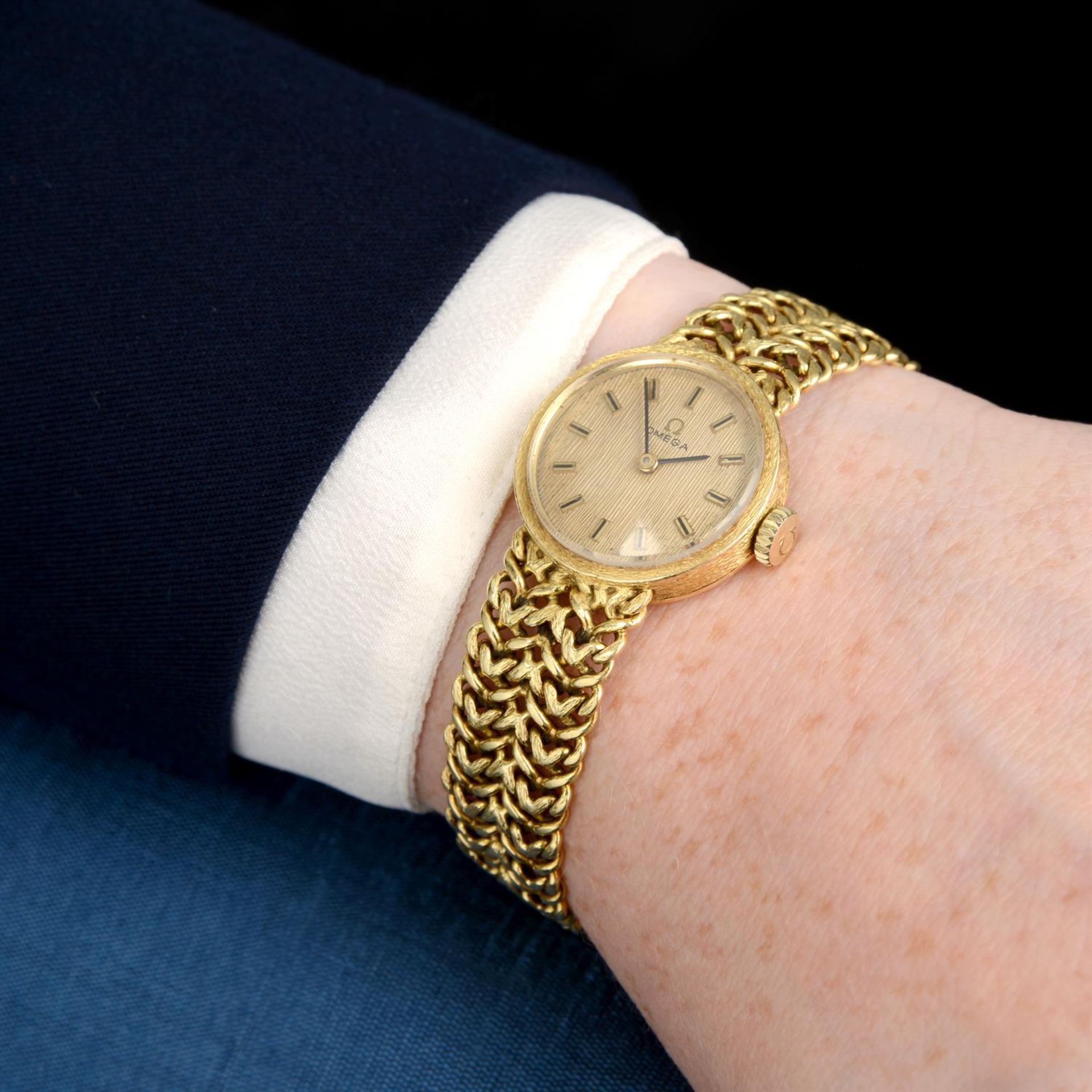 OMEGA - an 18ct yellow gold bracelet watch, 21mm. - Image 5 of 5