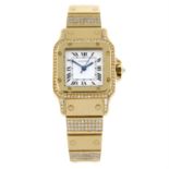 CARTIER - a yellow metal Santos bracelet watch. 24mm.