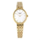 LONGINES - an 18ct yellow gold Prestige bracelet watch, 20mm.