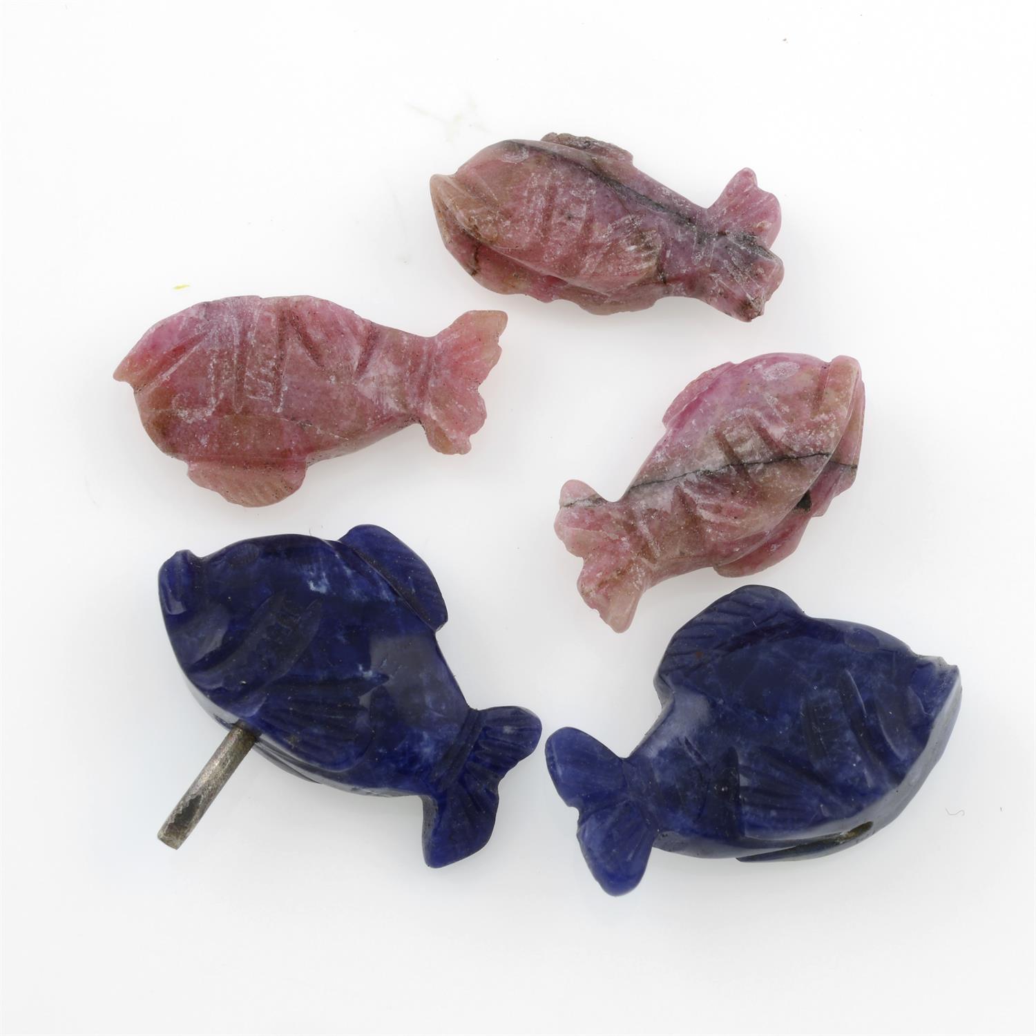 STUART DEVLIN STOCK - Two carved sodalites and nine carved rhodonites resembling fishes,