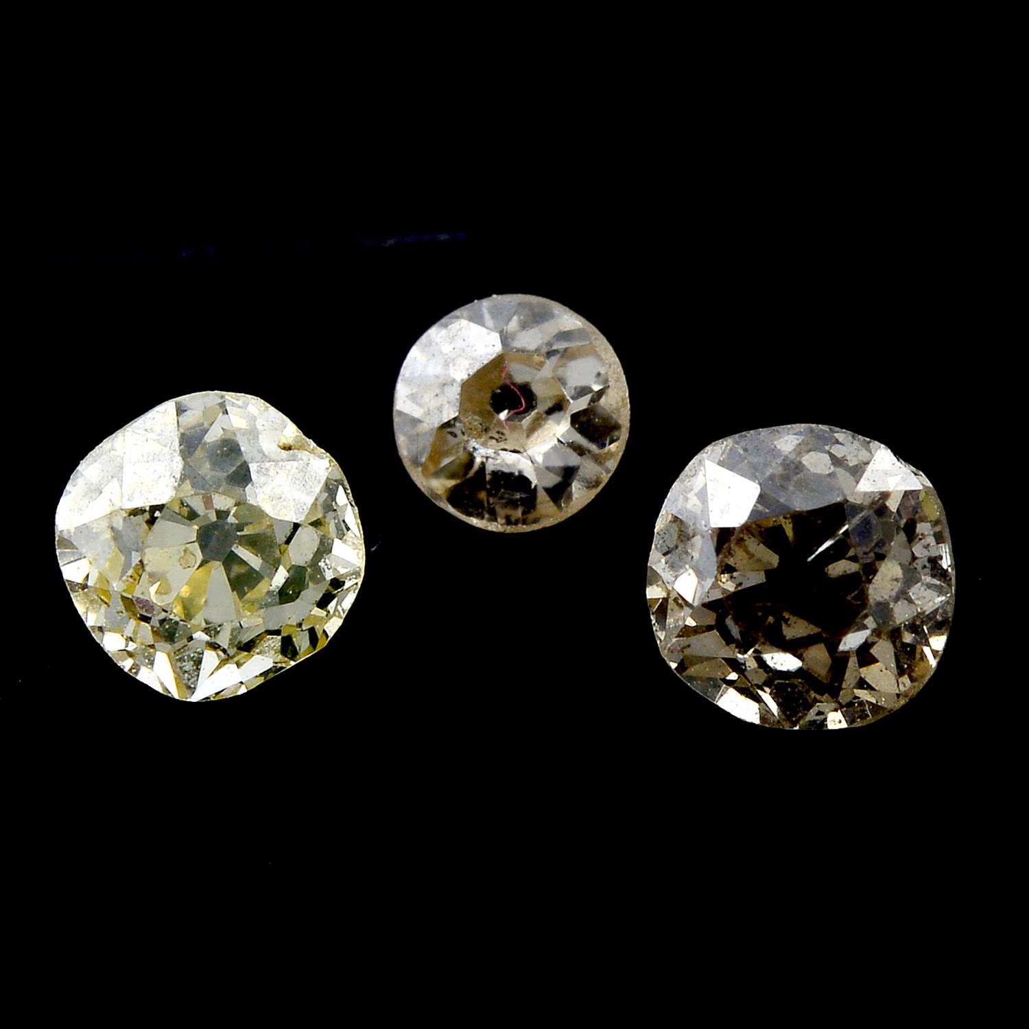 Three old cut diamonds and twenty rose cut diamonds, weighing 1.22ct