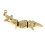 A 9ct gold articulated crocodile charm pendant.