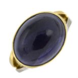 An iolite cabochon single-stone ring.