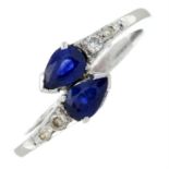 A sapphire and diamond crossover ring.