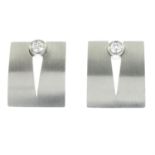 A pair of brilliant-cut diamond stud earrings of contemporary design.