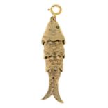A 9ct gold articulated fish charm pendant.