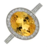 An 18ct gold citrine and brilliant-cut diamond cluster ring.