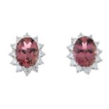 A pair of pink tourmaline and diamond cluster earrings.