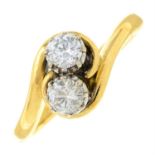 An 18ct gold diamond two-stone crossover ring.