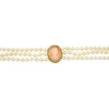 A cultured pearl three-row choker necklace, with 9ct gold shell cameo central pendant.