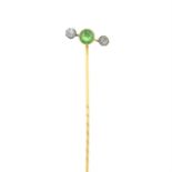 A 9ct gold green and colourless paste stickpin.