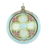 An early 20th century silver enamel floral powder compact pendant.