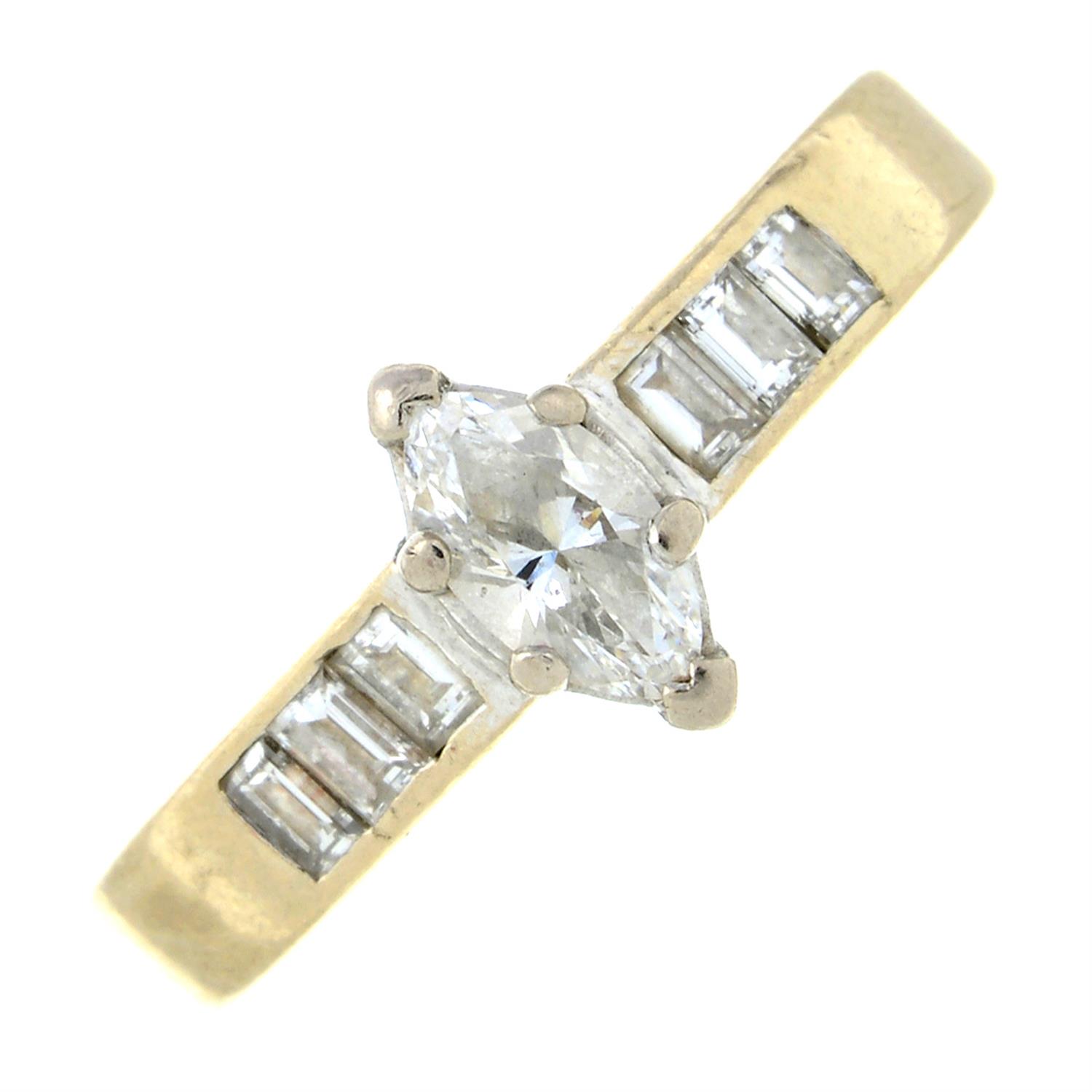 An 18ct gold marquise-shape diamond ring, with baguette-cut diamond sides.