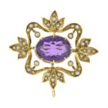 An early 20th century gold amethyst and split pearl brooch pendant.